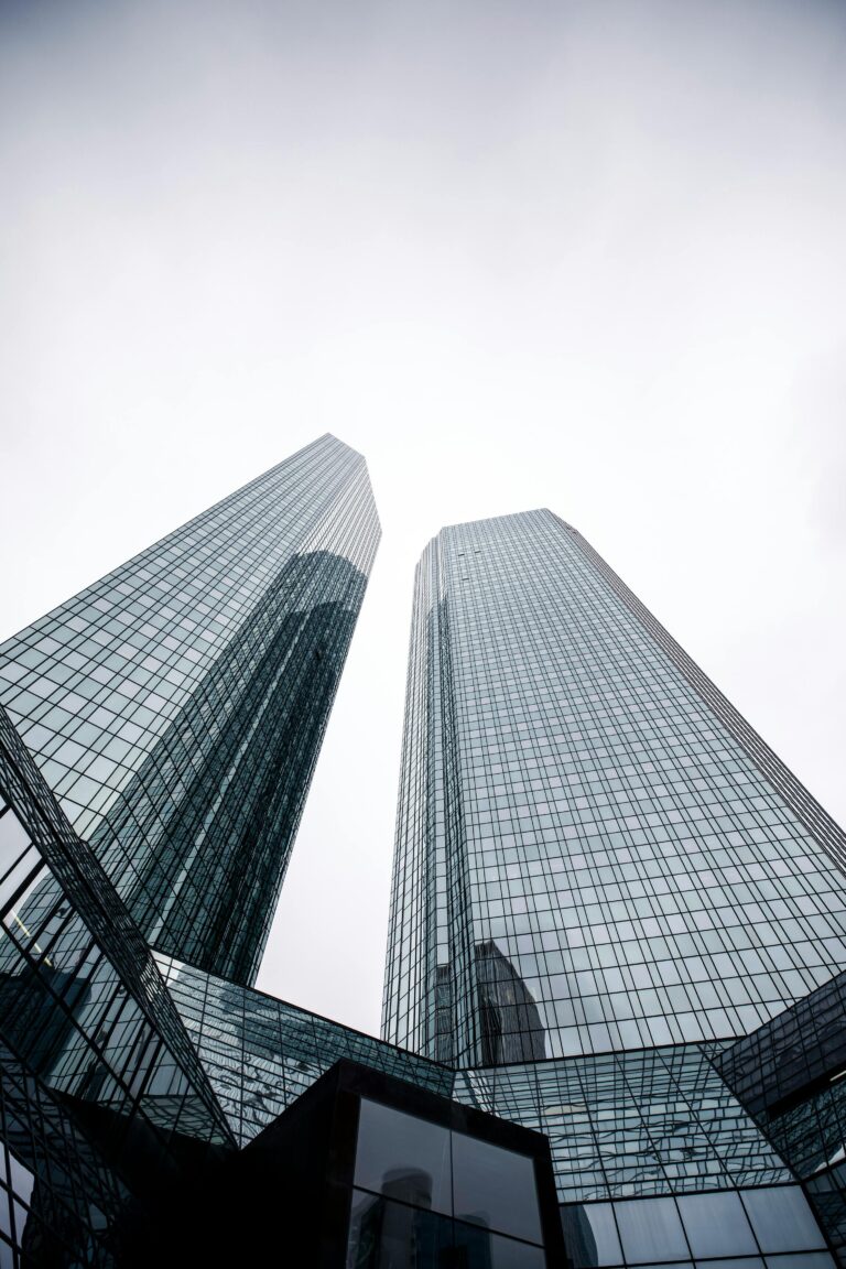 Low angle shot of modern skyscrapers with glass facades in Frankfurt, Germany.